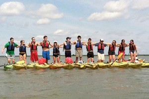 a group of friends enjoying the kayaking tour